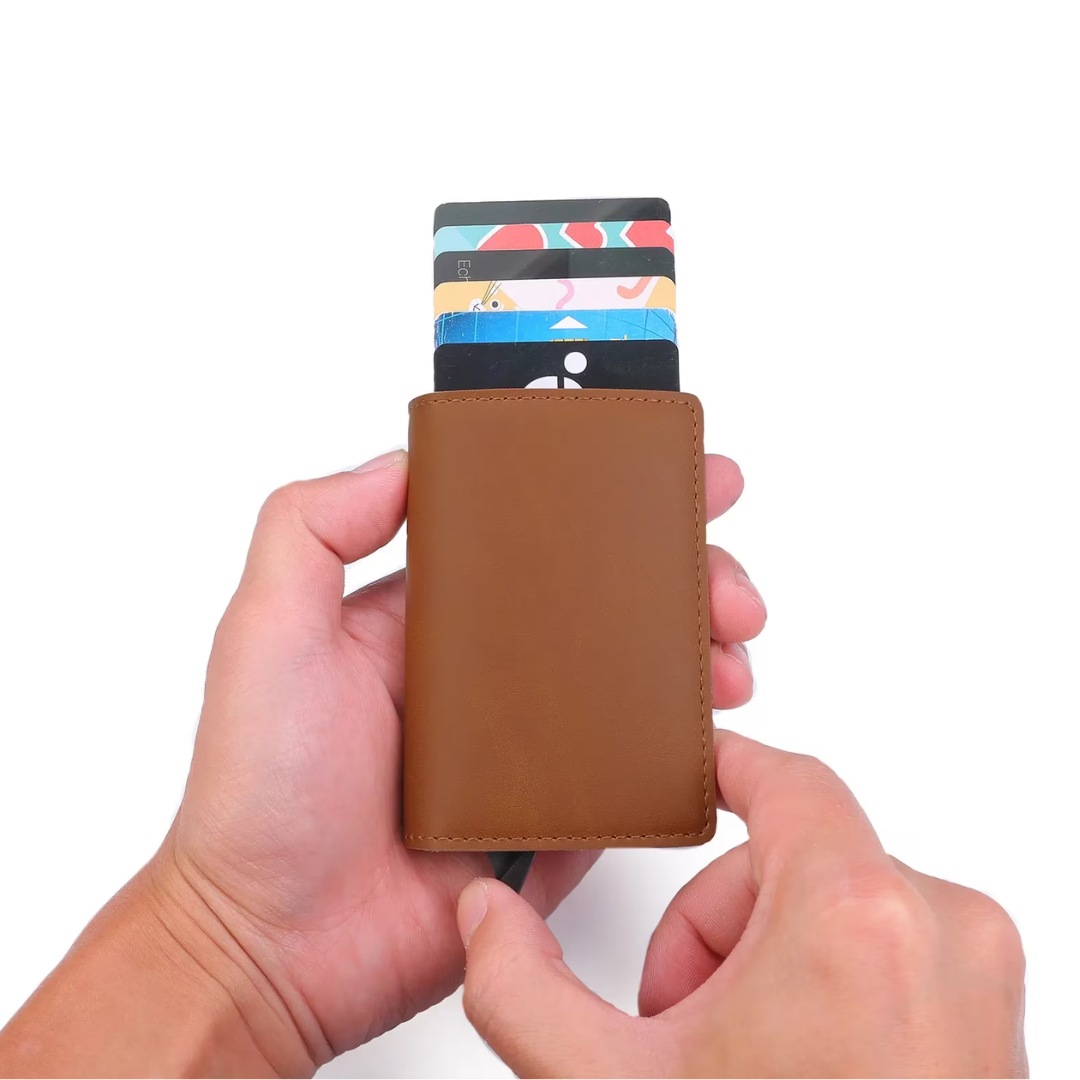 Man holding a modern aluminum RFID card holder wallet with an integrated money clip.