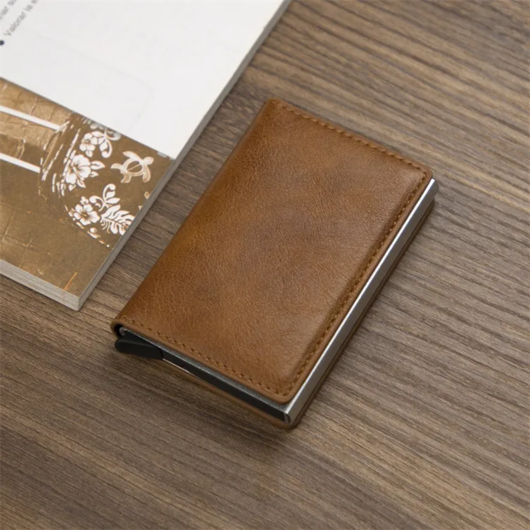Aluminum card holder wallet with money clip, securely holding multiple cards.