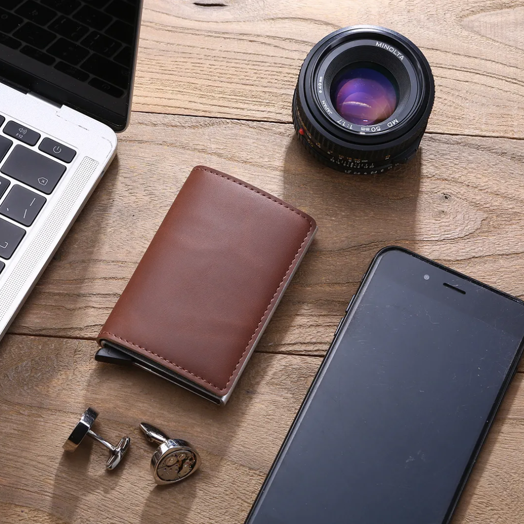Open aluminum RFID wallet revealing card slots and a strong money clip.
