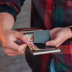 Men's slim aluminum RFID wallet with money clip fitting easily into a front pocket.
