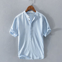 Casual men's short-sleeve button-up shirt in breathable fabric for everyday summer style & comfort.