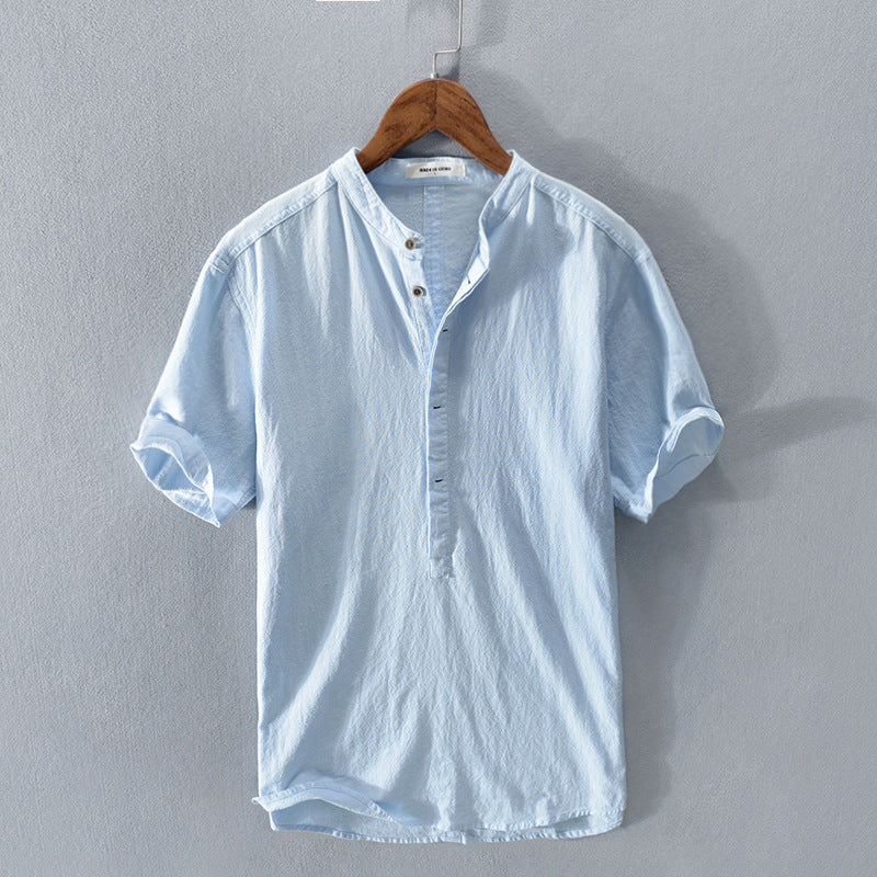 Casual men's short-sleeve button-up shirt in breathable fabric for everyday summer style & comfort.