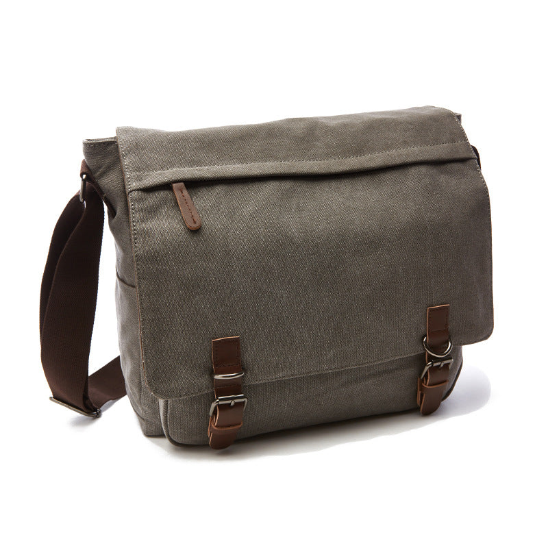 Practical men's canvas shoulder bag with adjustable strap and spacious compartments for versatile everyday and travel use.